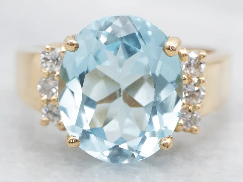 women’s oval-shaped engagement rings -Modern Gold Blue Topaz and Diamond Ring